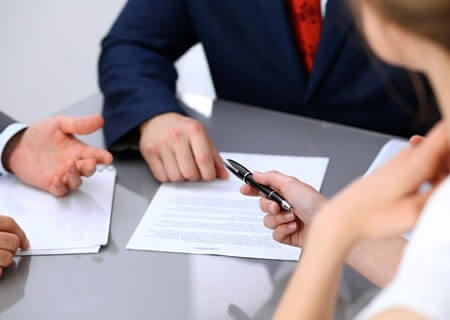 couple signing legal documents