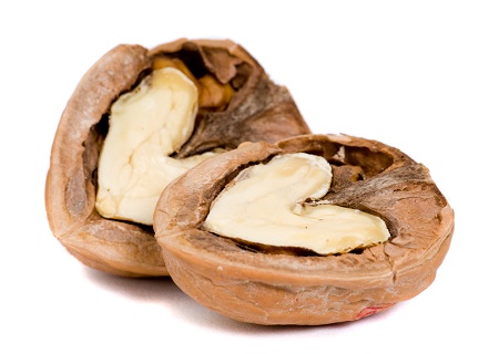 Walnut cracked in half with heart-shaped nut on the inside