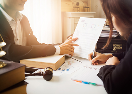 Business owner reviewing legal paperwork