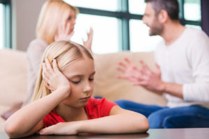 sad child listening to parents fight