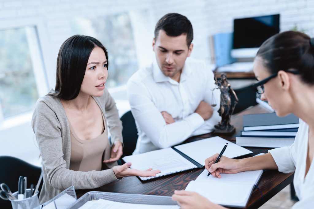 Divorce lawyer meeting with couple to start their divorce process