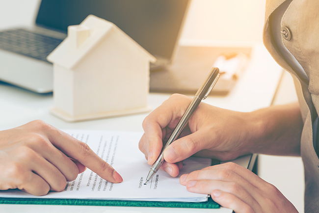 Person signing a legal document