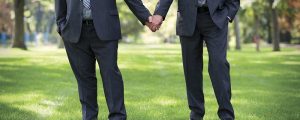 Same-sex couple holding hands