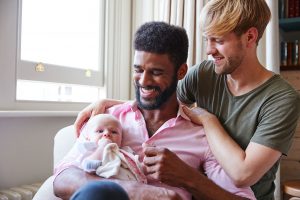 Same sex couple discussing second parent adoption with child