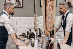 Man looking in mirror with relfection