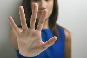 Woman holding open hand in front of her