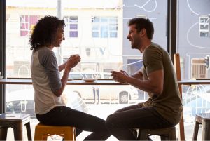 Man and woman sitting on in coffee shop