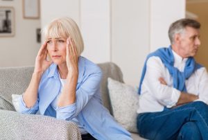 A woman and a man sitting on a couch