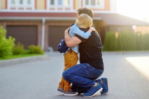 Father and child hugging